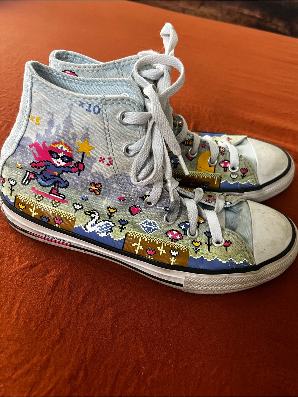 Converse Light Blue High-Top Sneakers with Pink Logo
